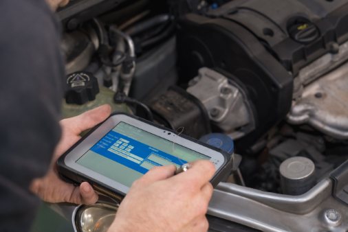 tech with a diagnostic tool
